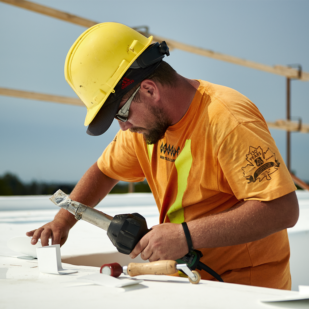 Commercial Roofing Contractor Working With TPO Welder